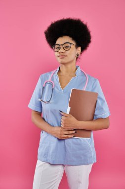 breast cancer awareness, african american doctor, female oncologist with folder, pink backdrop clipart