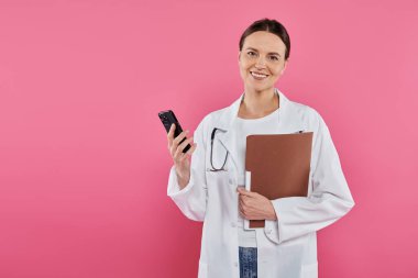 breast cancer awareness, female doctor, happy oncologist with folder using smartphone, digital age clipart