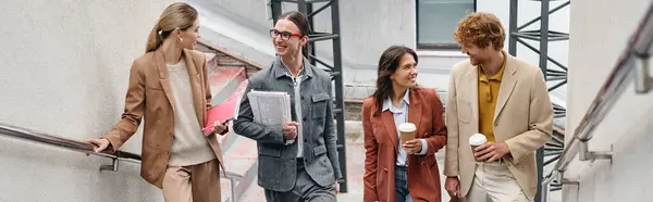 four smiling team members in smart outfits talking and looking at each other, coworking, banner