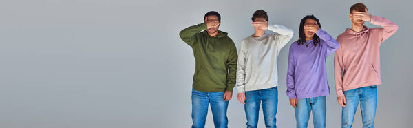 four friends in casual trendy outfits covering eyes with palms, cultural diversity, banner