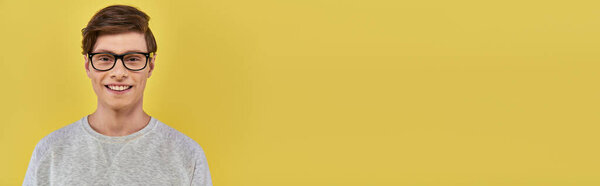 happy emotional man in casual attire and glasses smiling cheerfully and looking at camera, banner