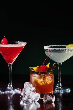 set of three esthetic freshening cocktails with berries and ice cubes on counter, concept clipart
