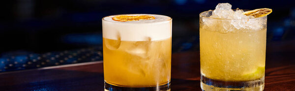 zesty caipirinha and sophisticated whiskey sour with bar on backdrop, concept, banner