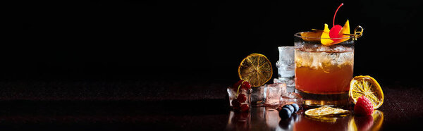 delicious refreshing negroni with fresh decorations on black background, concept
