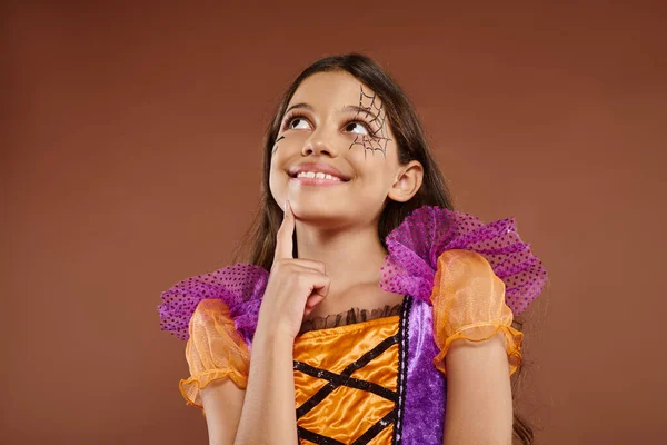Dreamy Girl Colorful Costume Halloween Makeup Looking Away Brown Background — Stock Photo, Image