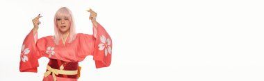 anime woman in pink  kimono sticking out tongue and showing mini hearts gesture on white, banner clipart