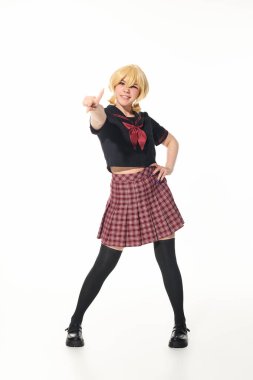 yellow blonde woman in school uniform standing with hand on hip and pointing at camera on white clipart