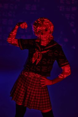 cosplay woman in school uniform showing muscles in neon light with hieroglyphs on blue backdrop clipart