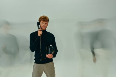 long blurred exposure photo of young man with retro phone surrounded by other male models, men power clipart