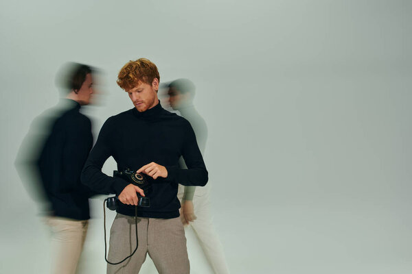 long exposure photo of multicultural trio in black turtlenecks with retro phone, men power
