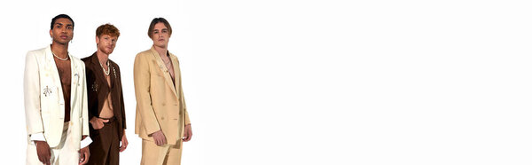 good looking trio in classy suits with accessories standing and looking at camera, men power, banner