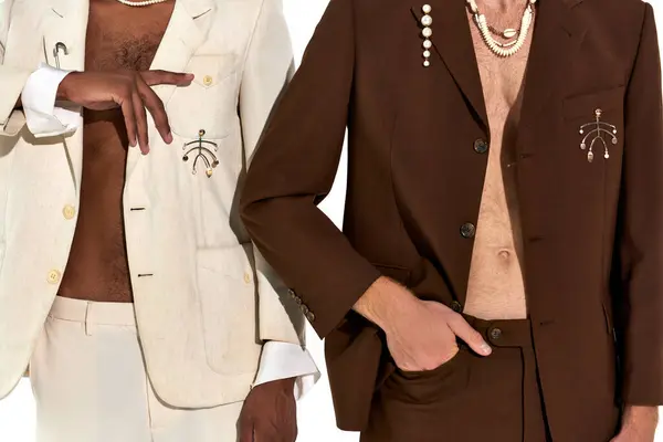 stock image cropped view of multicultural male models in elegant unbuttoned suits with accessories, men power