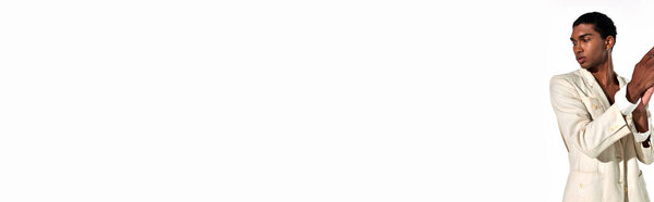 african american man in suit with accessories gesturing and looking away, fashion concept, banner