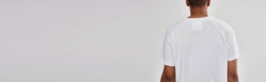 fashionable african american male model in casual white t-shirt, copy space for advertising, banner clipart