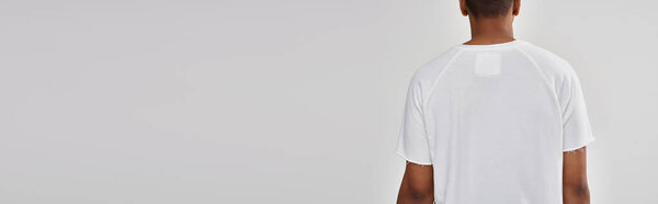 fashionable african american male model in casual white t-shirt, copy space for advertising, banner