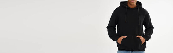 stylish african american male model in black hoodie and jeans, copy space for advertising, banner