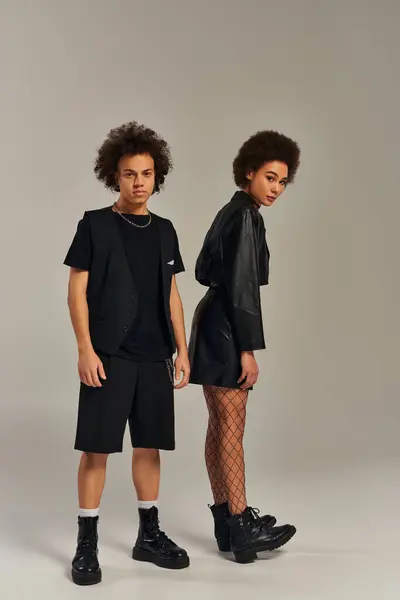 Attractive Stylish African American Siblings Fashionable Black Outfits Posing Actively — Stock Photo, Image