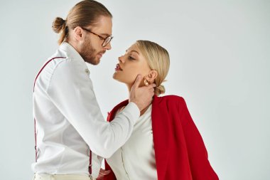 appealing boss and his secretary hugging and kissing lovingly while in office, work affair clipart