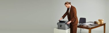 handsome man with beard and collected hair in elegant jacket working with copy machine, banner clipart