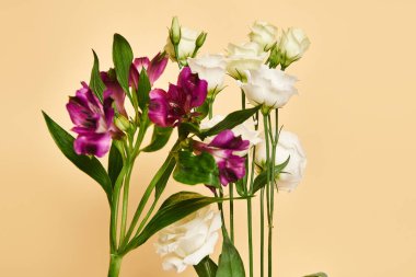 object photo of unique blooming lilies and eustoma flowers on pastel yellow background, nobody clipart