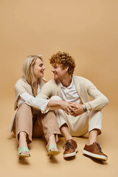 Cheerful Young Couple Light Colored Clothes Sitting Smiling Each Other — Stock Photo, Image