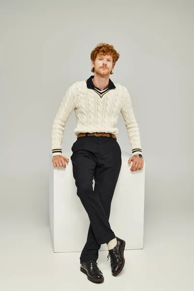 Fashionable Redhead Man Casual Clothes Sitting White Cube Looking Camera — Stock Photo, Image