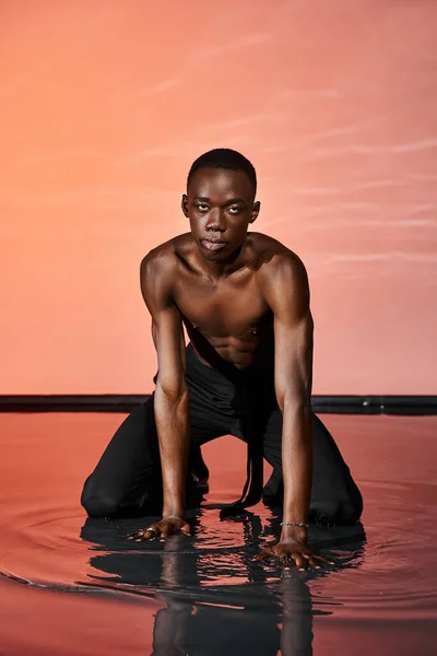 Alluring African American Man Wet Pants Sitting Water Surface Looking — Stock Photo, Image