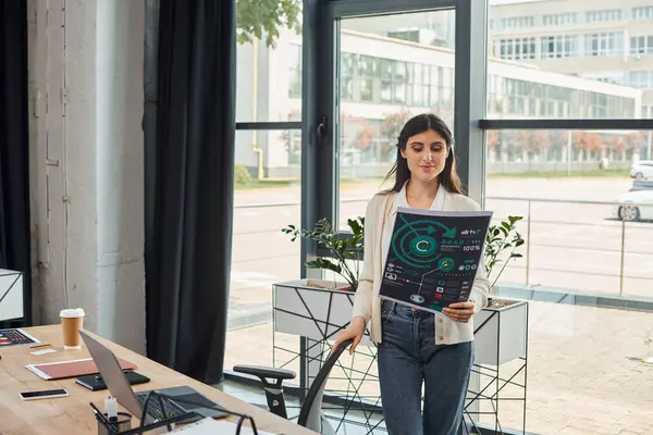 Businesswoman Stands Confidently Front Window Holding Charts Thoughtful Expression — Stock Photo, Image