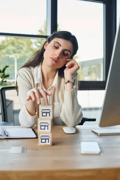 Woman Sits Her Desk Modern Office Stacks Blocks Wooden Table — Stock Photo, Image