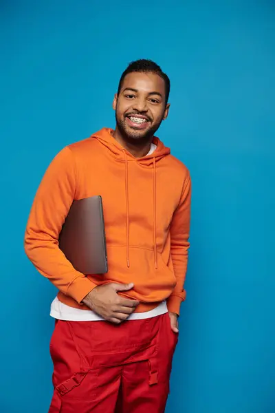 Attractive African American Guy Vibrant Outfit Posing Laptop Arm Blue — Fotografia de Stock