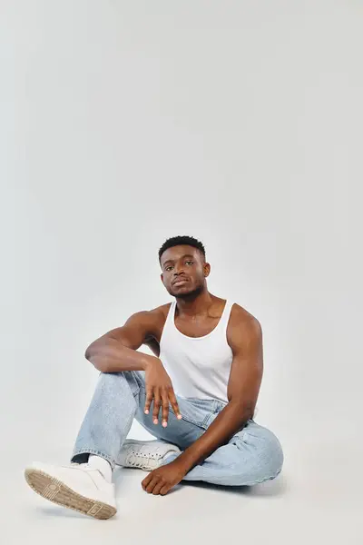 Young African American Man Sits Cross Legged Ground Exuding Sense — Stock Photo, Image