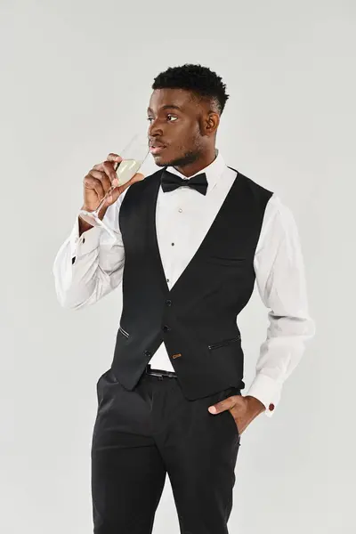 Sophisticated Man Tuxedo Gracefully Holds Glass Champagne Exuding Elegance Charm — Stock Photo, Image