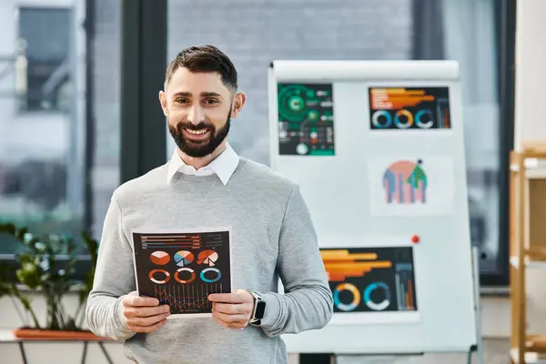 Man Beard Smiling Holding Charts While Standing Office — Foto Stock