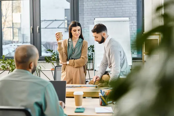 stock image Diverse group of professionals brainstorming and discussing ideas around a table in a modern office setting.