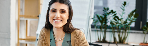 A woman immersed in her work, brainstorming and strategizing at a desk in a vibrant office setting.