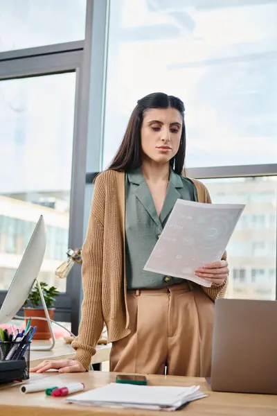 Woman Standing Confidently Front Laptop Computer Bustling Office Engrossed Her —  Fotos de Stock