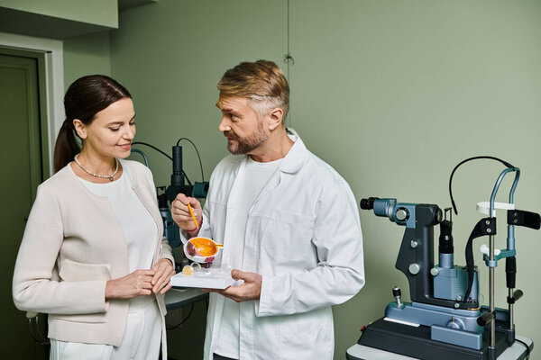 A man and a woman stand together in a room.
