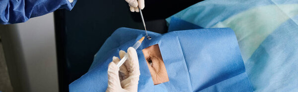 A person in white gloves carefully cutting a piece of fabric.
