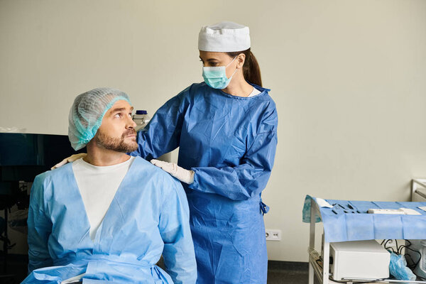 A man sits on bed in a hospital room.