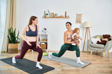A young beautiful mother and her baby are practicing yoga poses together at home with the guidance of an instructor. clipart