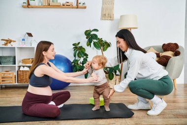 A young beautiful mother engaging in playful yoga movements with her baby on a mat, guided by a coach at parents courses. clipart