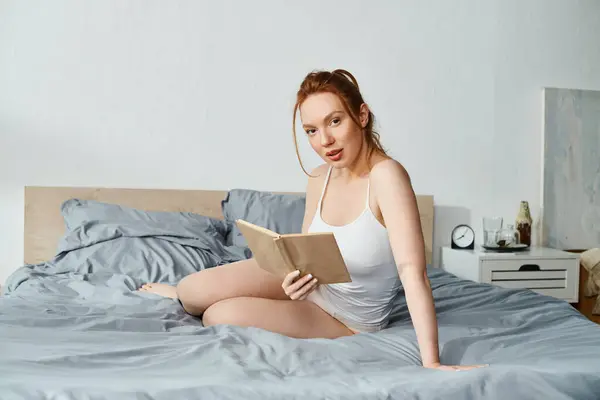 Woman Elegant Attire Peacefully Reads Book While Sitting Bed — Foto de Stock
