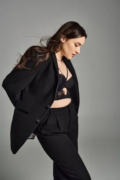 Stylish Size Woman Black Suit Striking Confident Pose Gray Backdrop — Stock Photo, Image
