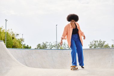 A young African American woman with curly hair skilfully rides a skateboard up the side of a ramp in a vibrant skate park. clipart