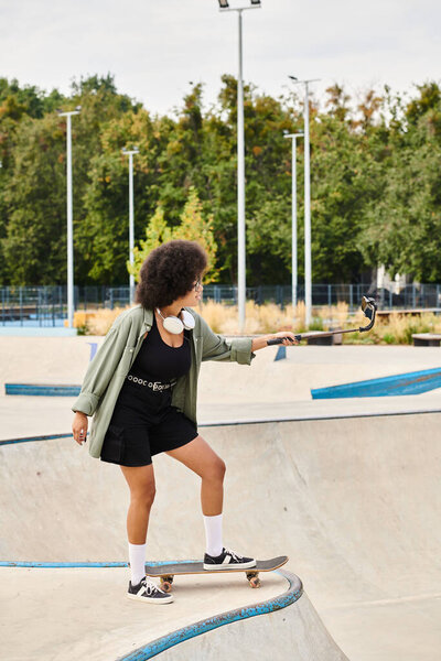 A young African American woman with curly hair riding a skateboard with skill and confidence at a bustling skate park.