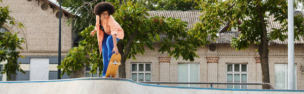 A young man energetically rides a skateboard up a ramp in a skate park, showcasing his skills and determination.