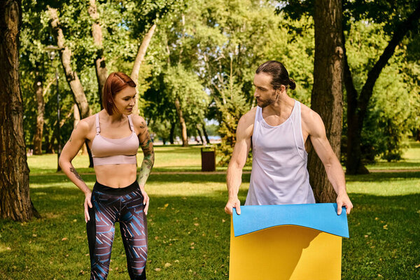 woman and her personal trainer, are exercising in a park, showing determination and motivation.