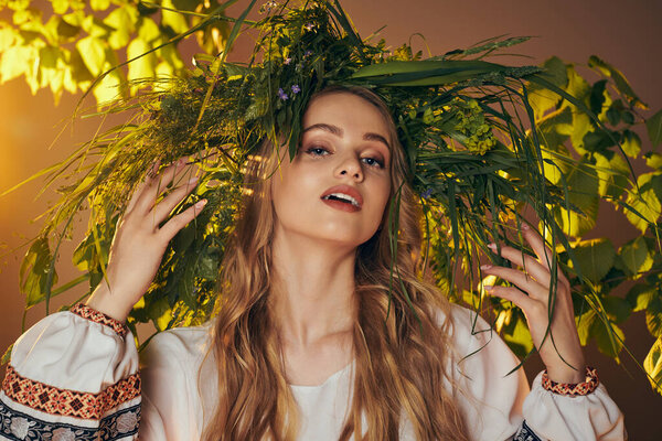 A young woman with flowing hair in a white shirt, exuding an ethereal presence in a fairy and fantasy-inspired studio setting.