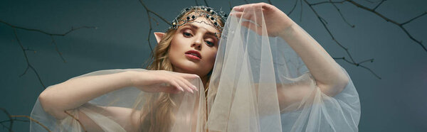 A young woman adorned in a tiara and veil poses gracefully in front of a majestic tree, embodying the spirit of an elf princess.