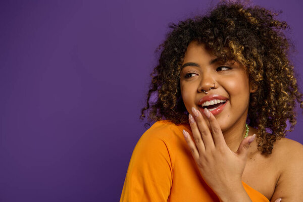 A striking African American woman, styled impeccably, exudes confidence against a colorful backdrop.